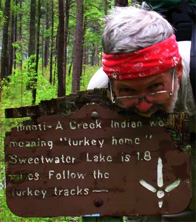 John eats a sign which translates the Cherokee word Pinhoti as home of the turkey.